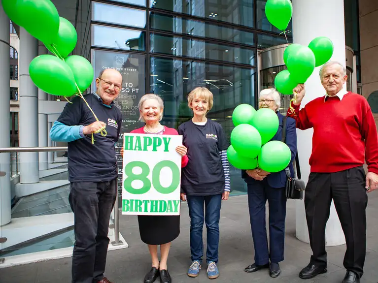 80 year old CAFOD supporters take a message to the World Bank