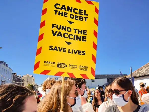 UK - Plymouth - Cornwall G7 2021 - Cancel the Debt placard at vaccines protest - Liam Finn