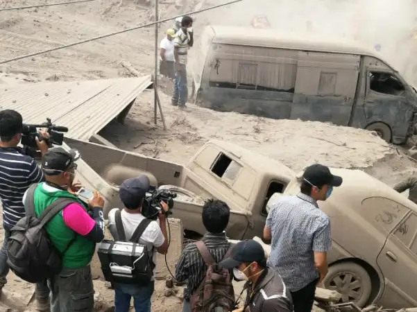 Guatemala - El Fuego Volcano - Ash and vehicles