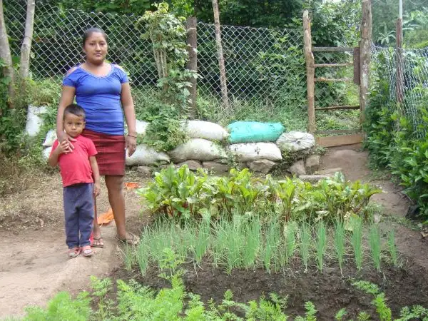Latin America - Nicaragua - Suhey and son in vegetable garden